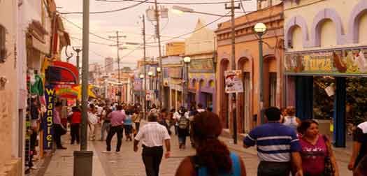 street-in-the-city-of-valencia people in a shopping street in the city of valencia in the west of venezuela.