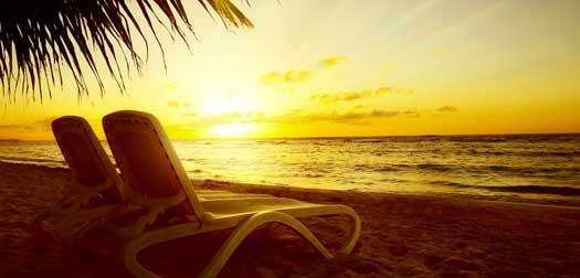 Art Sunrise view at resort. Relaxing holiday landscape. Two chai Art Sunrise view at resort. Relaxing holiday landscape. Two chaise longue on beach with palm tree.