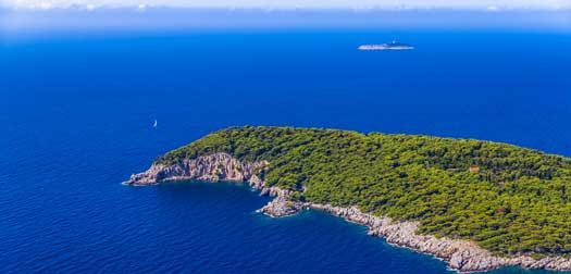Island Kolocep at Elaphites near Dubrovnik Rocky beach on Elaphites island Kolocep - Dubrovnik archipelago.