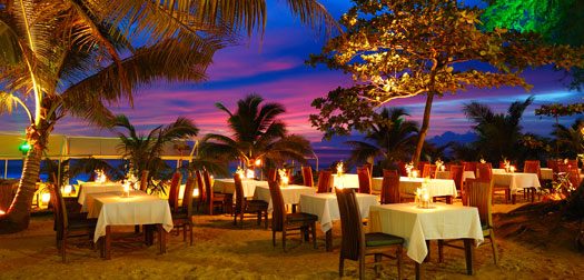 Outdoor restaurant at the beach during sunset, Phuket, Thailand