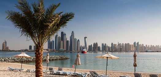 On the beach in Dubai The business district of Dubai