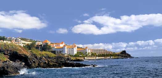 Resort by a rocky beach in Canico de Baixo, hotel Oasis Atlantic, Madeira. Madeira coastline, Canico de Baixo