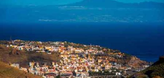 san-sebastian-la-gomera top view on san sebastian city the capital of la gomera island with teide volcano on the background