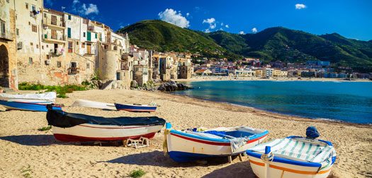 Old beach in Cefalu with fishing boats old wooden fishing boats on the beach of Cefalu