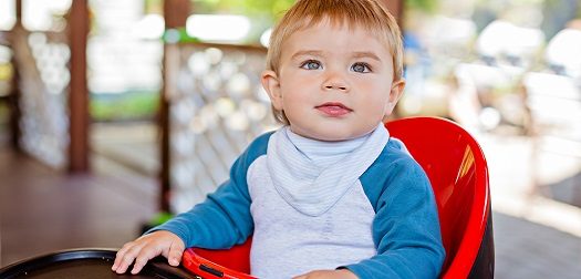 baby boy sitting in highchair