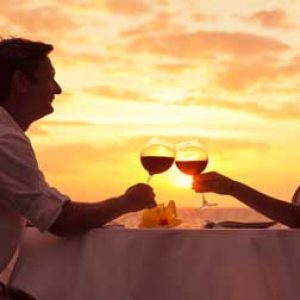 Couple enjoyng diner while on all inclusive lefkas holidays